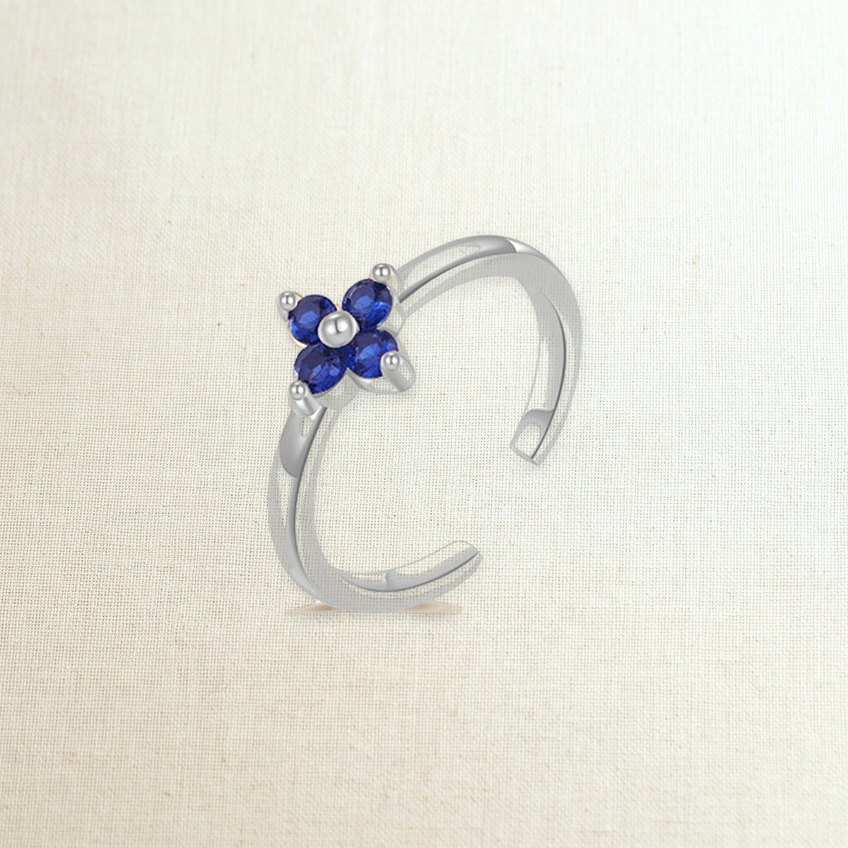 Anello per piede con fiore di zirconi, blu / color argento