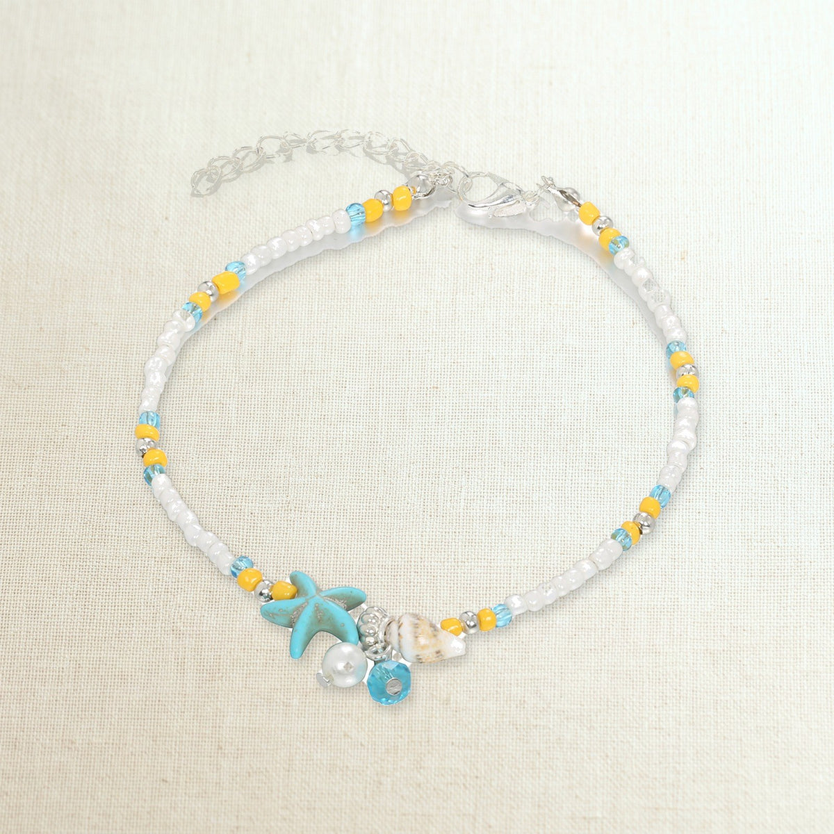 Cavigliera boho di perline con stella marina turchese, foto prodotto