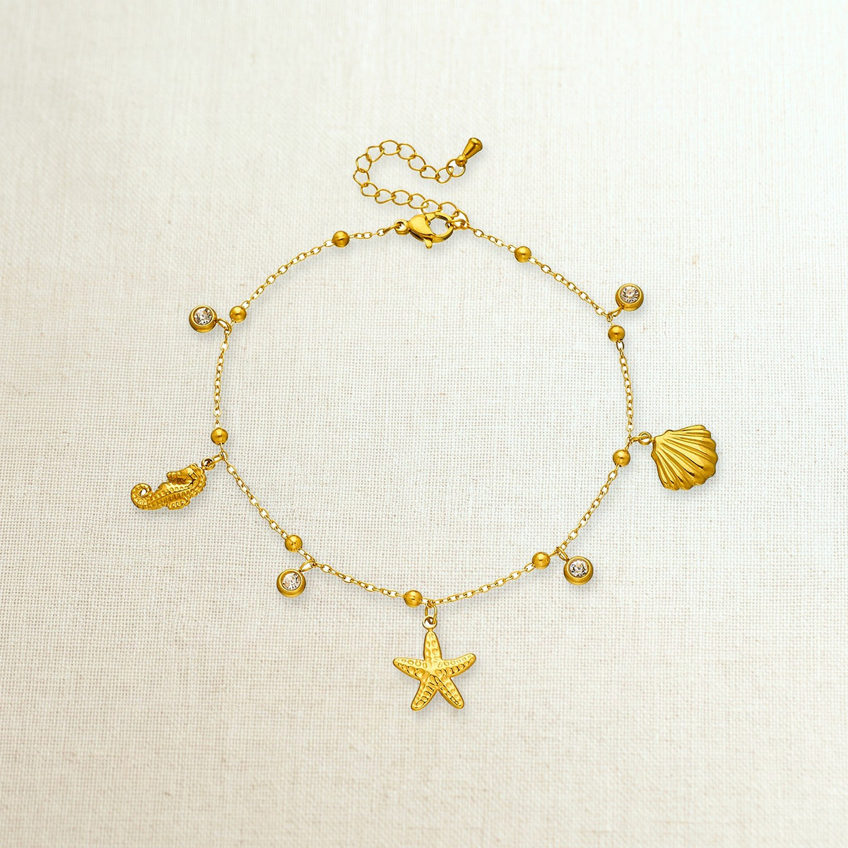 Cavigliera con charm marini in acciaio 316L, foto prodotto