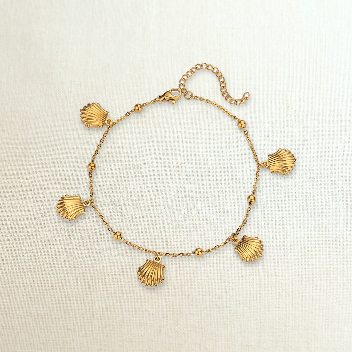 Cavigliera con stelle marine, conchiglie e delfini in acciaio 316L, conchiglie
